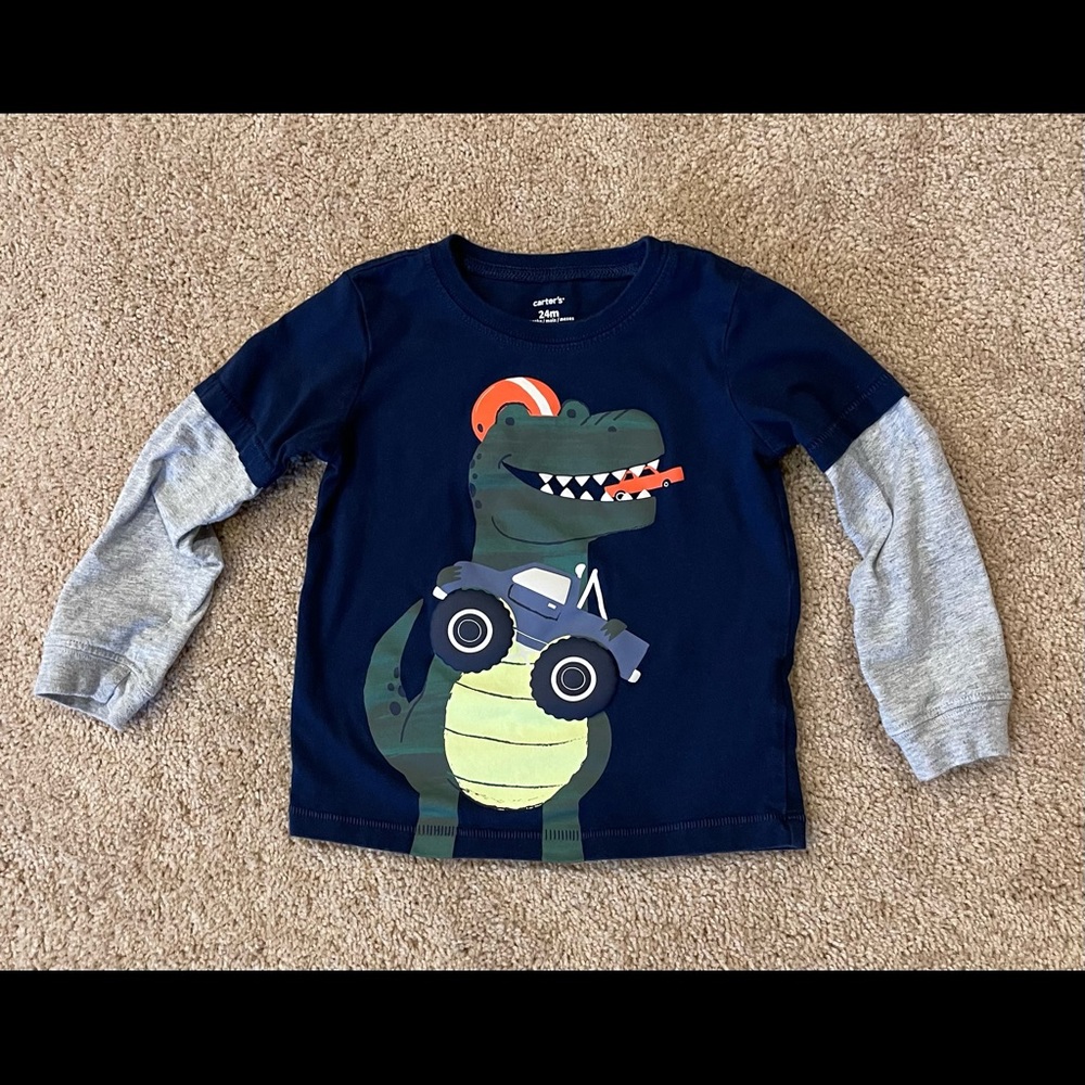 Love dinos, big trucks and football? This long sleeve is for you!